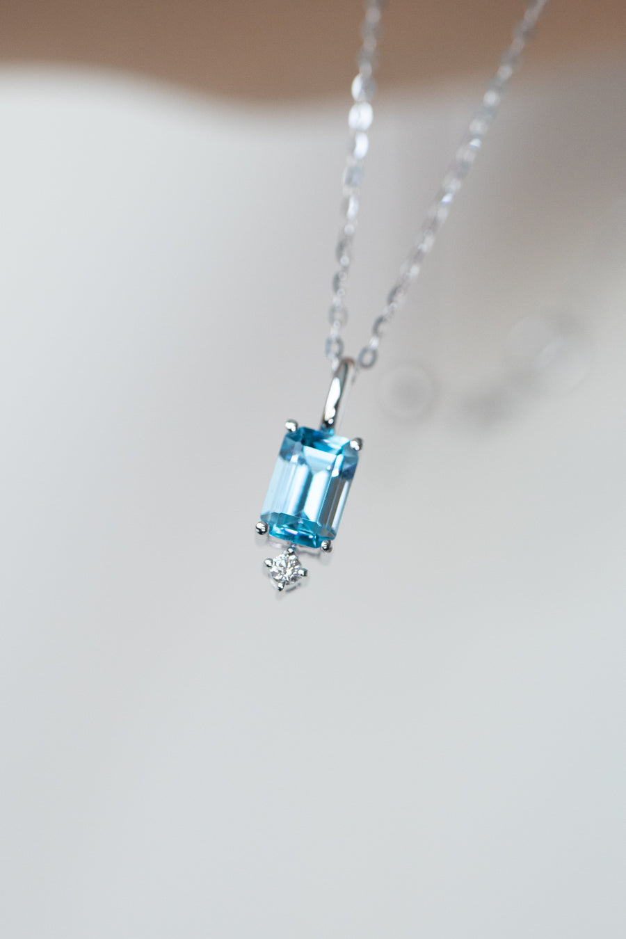 Lightly Swiss Blue ~0.70carat Emerald Cut Topaz and 0.02carat diamond 18K White Gold Necklace