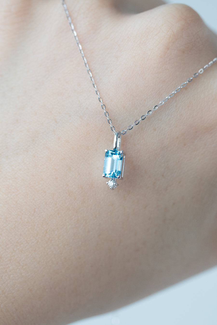 Lightly Swiss Blue ~0.70carat Emerald Cut Topaz and 0.02carat diamond 18K White Gold Necklace