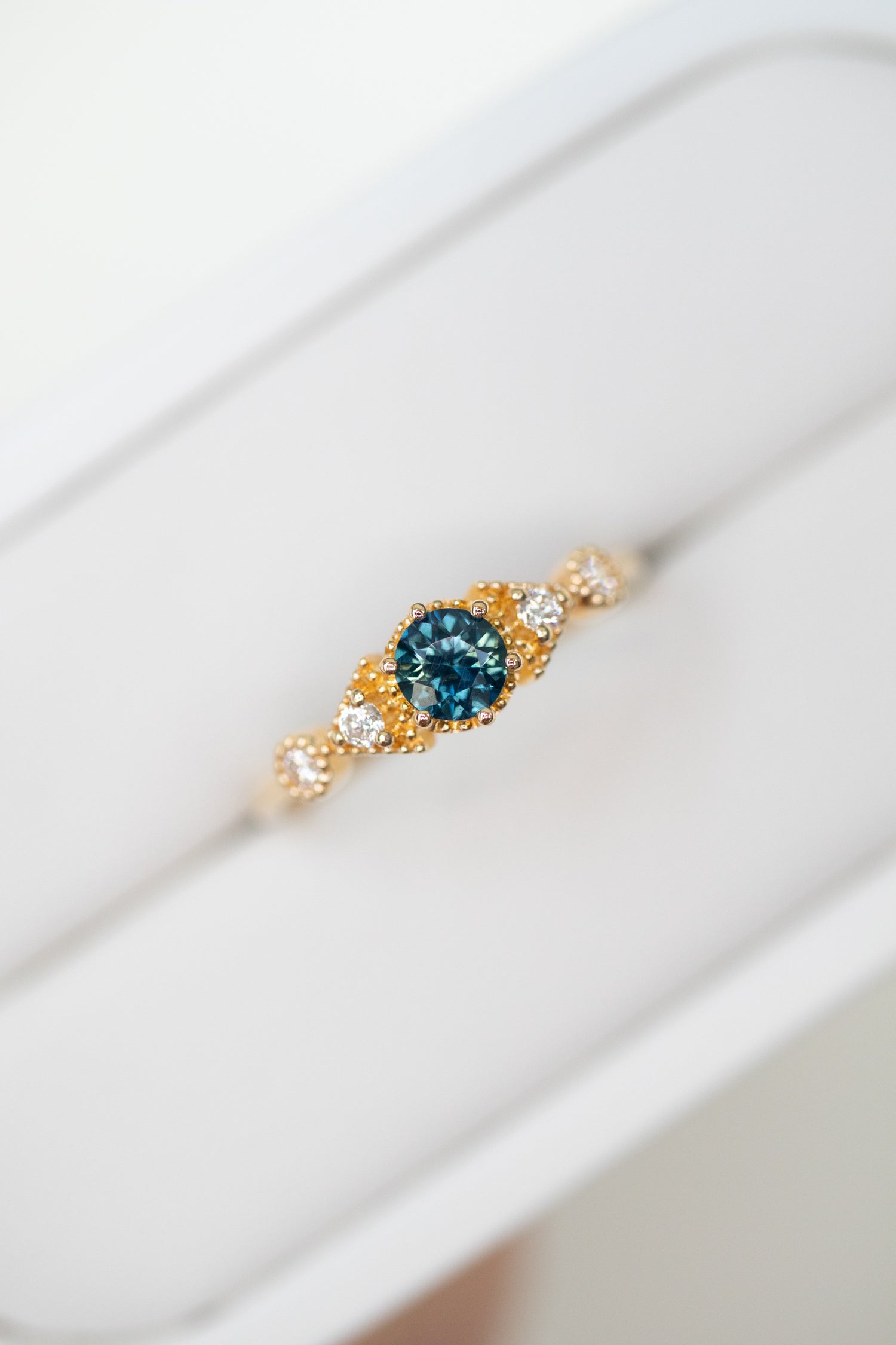 PREORDER - Triangle-shaped Five Stone Teal Blue Sapphire ~0.23-0.28ct & diamonds 18K Gold Ring