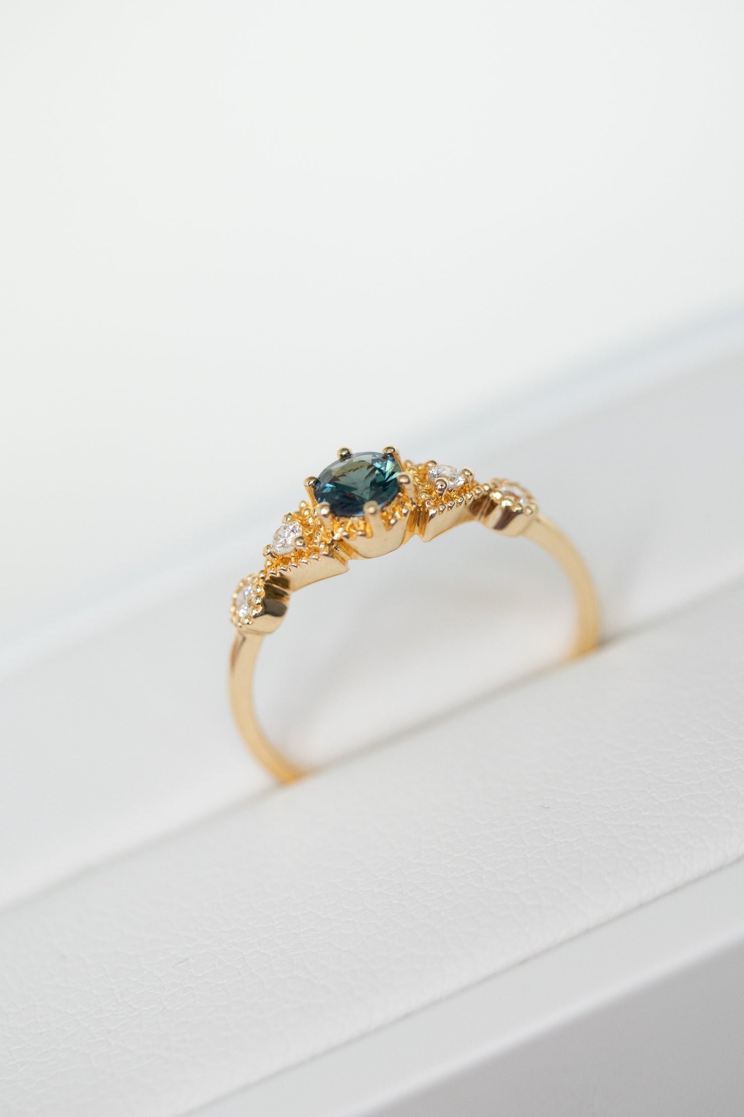 PREORDER - Triangle-shaped Five Stone Teal Blue Sapphire ~0.23-0.28ct & diamonds 18K Gold Ring