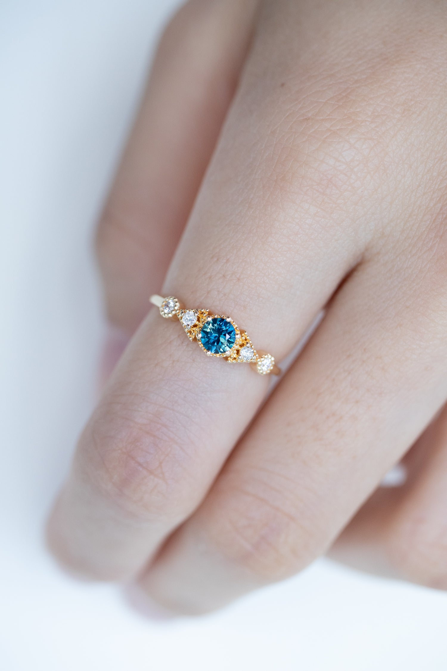 PREORDER - Triangle-shaped Five Stone Teal Blue Sapphire ~0.23-0.28ct & diamonds 18K Gold Ring