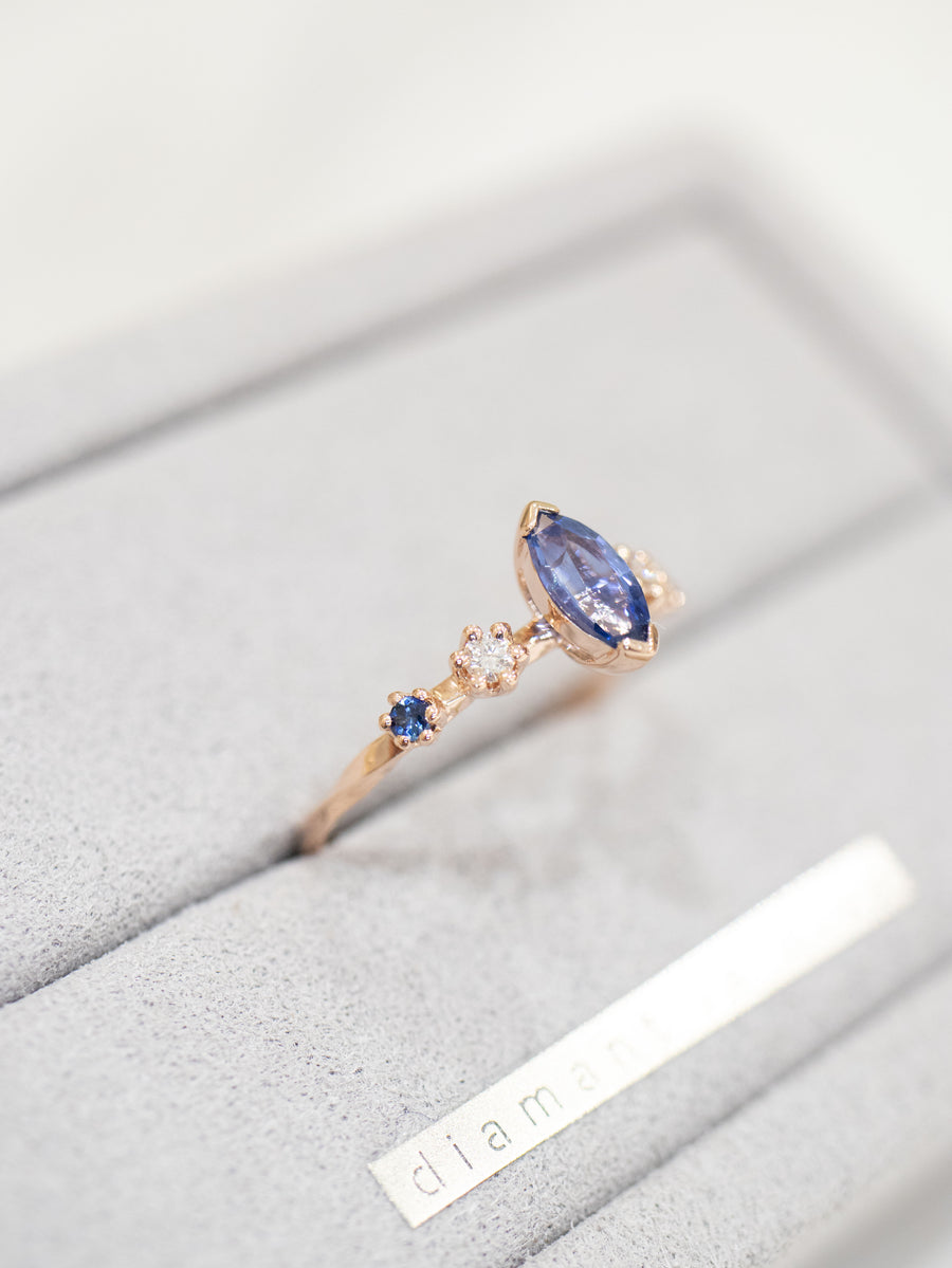 Marquise 0.50ct Blue Sapphire & diamond 14/18K Gold twisted Ring
