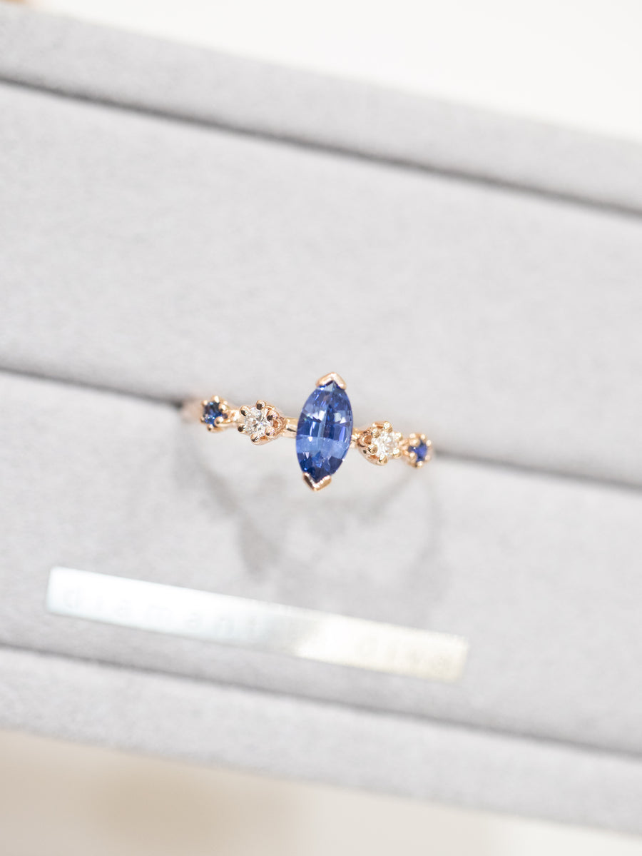 Marquise 0.50ct Blue Sapphire & diamond 14/18K Gold twisted Ring