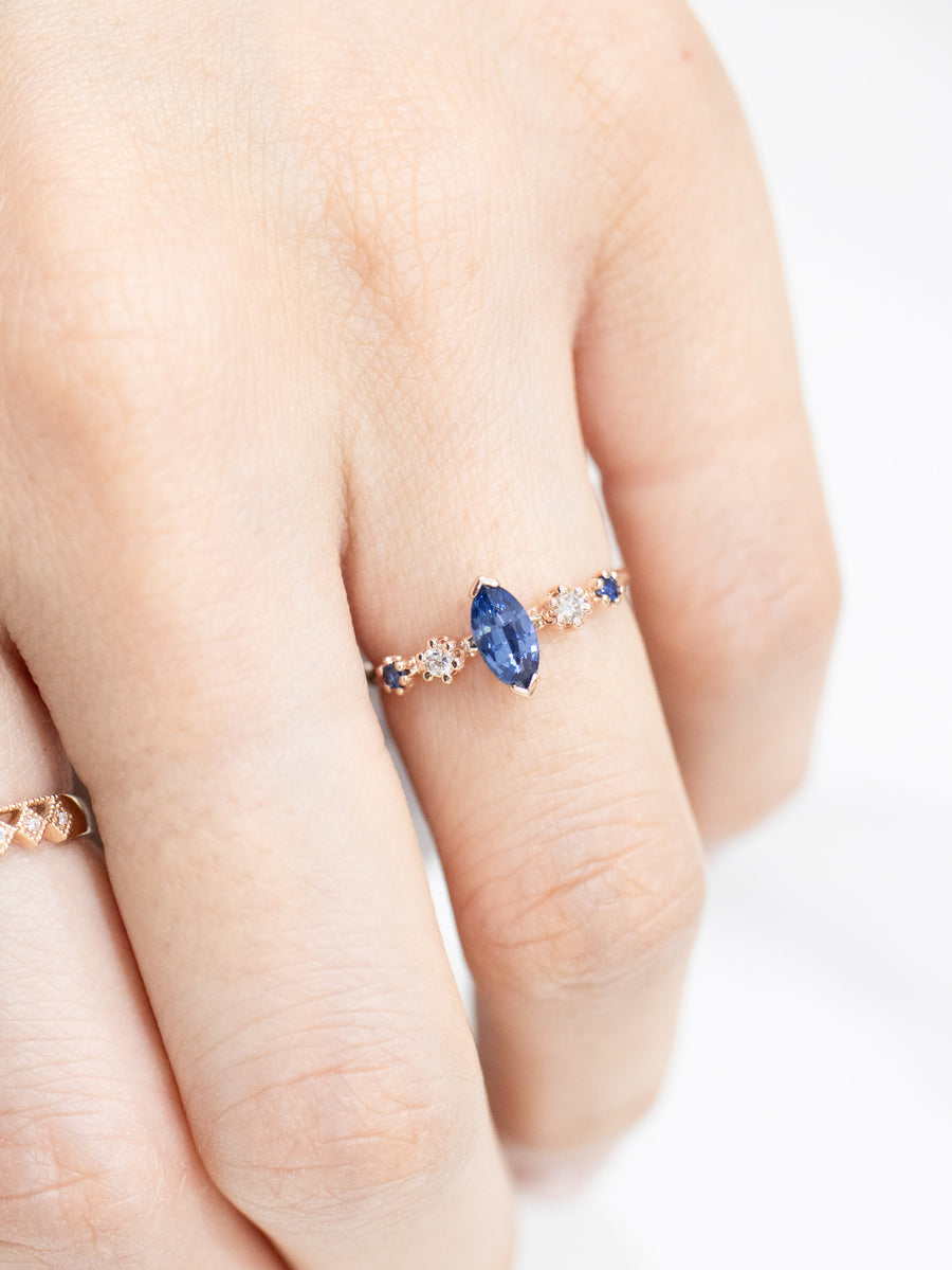 Marquise 0.50ct Blue Sapphire & diamond 14/18K Gold twisted Ring